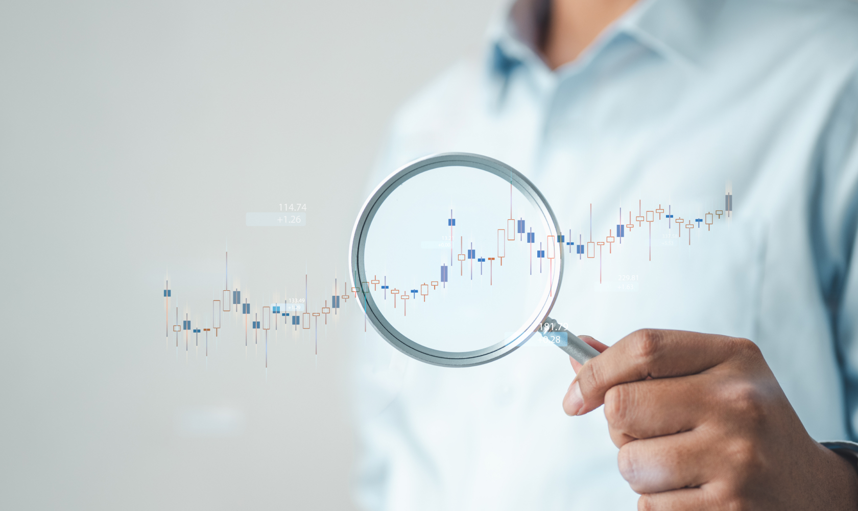 A person holds a magnifying glass over an upward trending chart, highlighting return data analysis and business insights