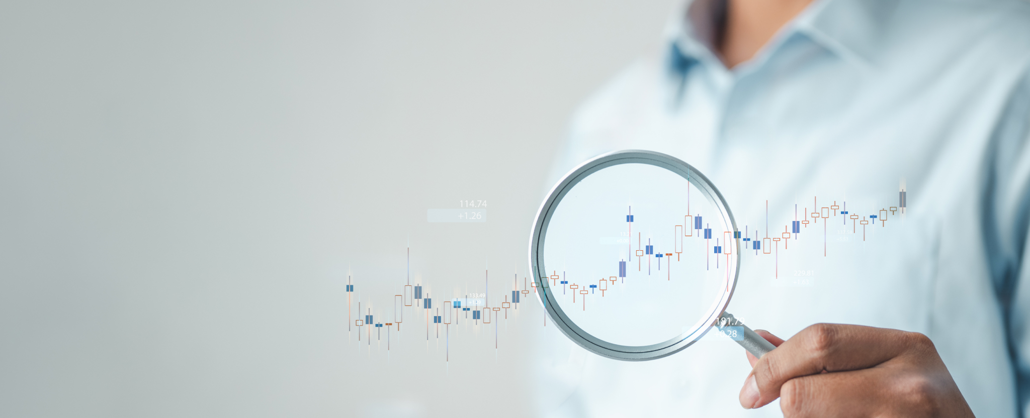A person holds a magnifying glass over an upward trending chart, highlighting return data analysis and business insights