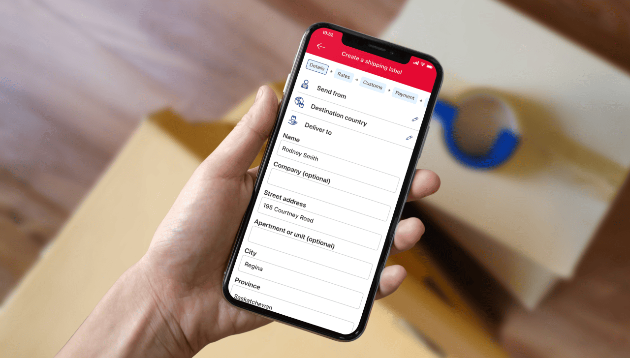 A smartphone displays the Canada Post app “Create a shipping label” page with sender, destination country and address fields.