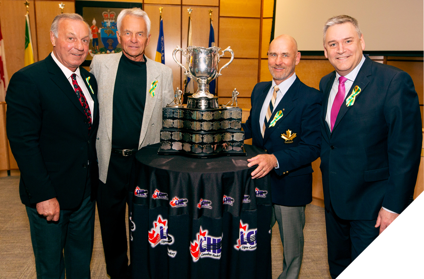 Former NHL players Guy Lafleur, Dennis Sobchuk and Ed Staniowski with Memorial Cup and Doug Ettinger, CEO, Canada Post.