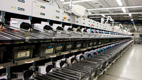A row of large commercial printing equipment.