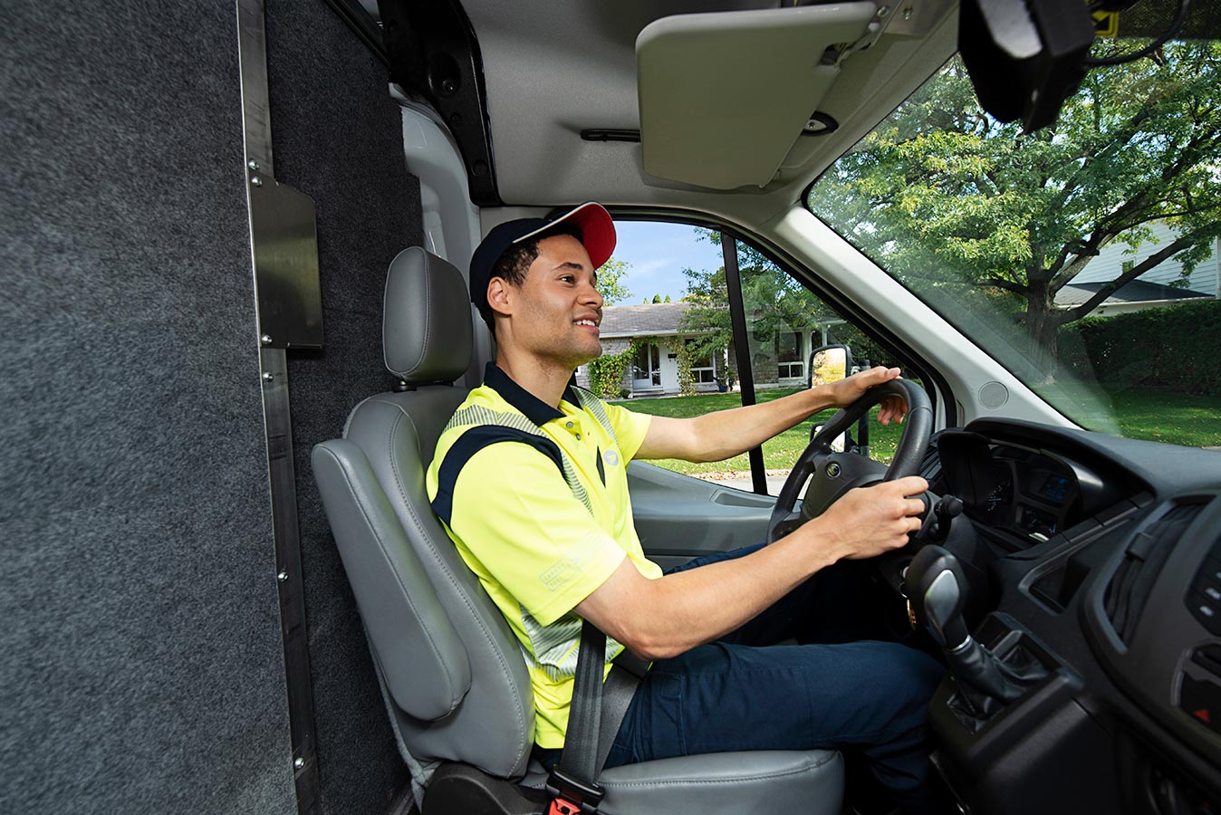 Delivery agent driving a mail delivery truck